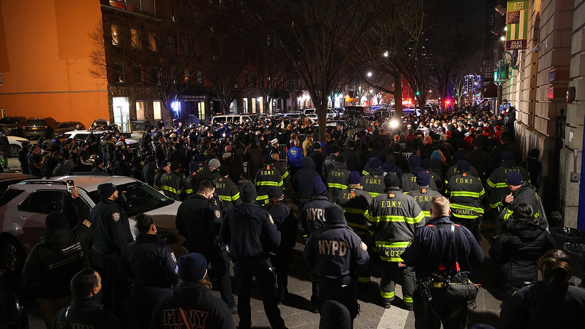 "We’re in a battle with a small number of people that believe they will hold our city hostage with violence," Mayor Adams told mourners outside the 32nd Precinct in Harlem, according to the AM New York Metro newspaper.