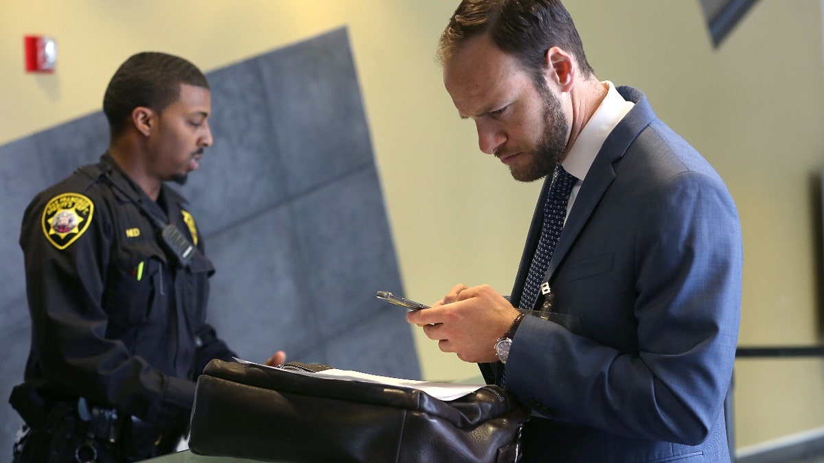 Deputy public defender Chesa Boudin checks in at county jail