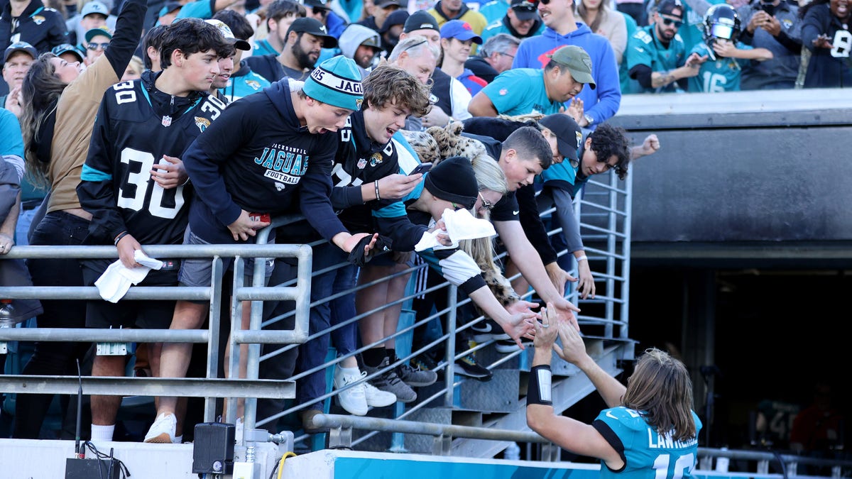 Trevor Lawrence of the Jaguars celebrates with fans following the Buffalo Bills game at TIAA Bank Field on Nov. 7, 2021, in Jacksonville, Florida.