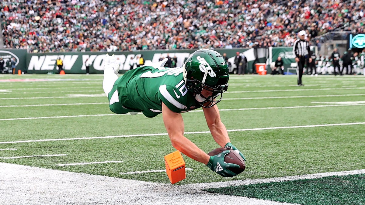 Braxton Berrios #10 of the New York Jets leaps into the end zone for a touchdown  in the second quarter of the game against the Tampa Bay Buccaneers at MetLife Stadium on January 02, 2022 in East Rutherford, New Jersey. 