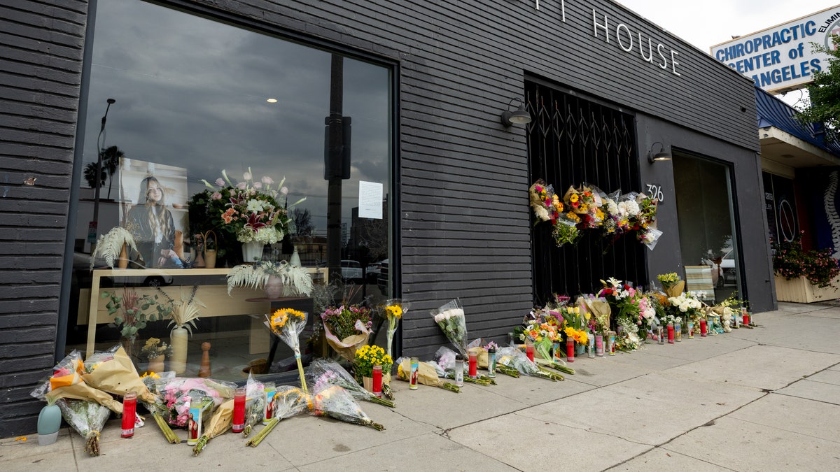 Flowers are placed outside Croft House furniture store in memory of graduate student Brianna Kupfer on Thursday January 13th in Los Angeles. (Photo by Emma McIntyre/Getty Images)