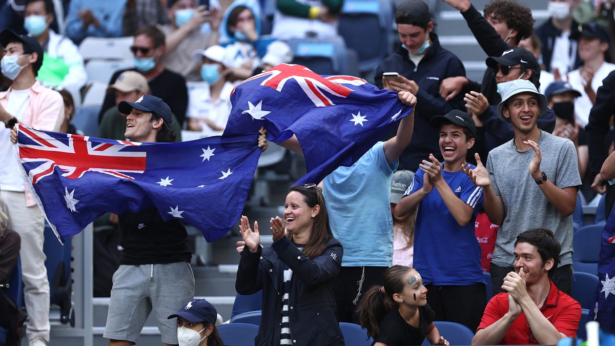 Fans cheer during the round one singles match match between Nick Kyrgios of Australia and Liam Broady of Great Britain during day two of the 2022 Australian Open at Melbourne Park on Jan. 18, 2022 in Melbourne, Australia. 