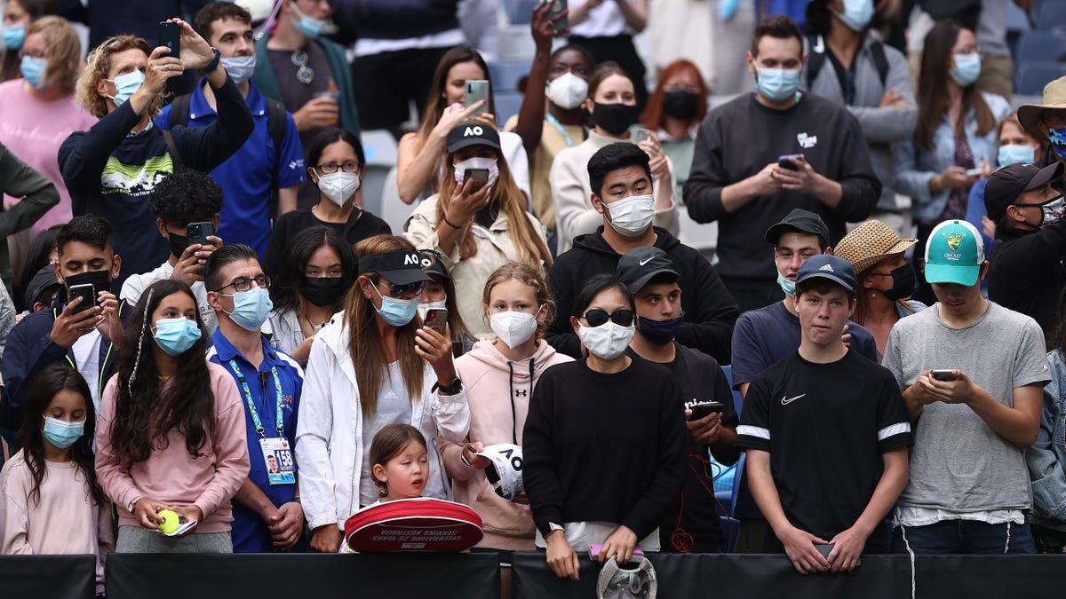 Fans cheer during the round one singles match match between Nick Kyrgios of Australia and Liam Broady of Great Britain during day two of the 2022 Australian Open at Melbourne Park on Jan. 18, 2022 in Melbourne, Australia. 