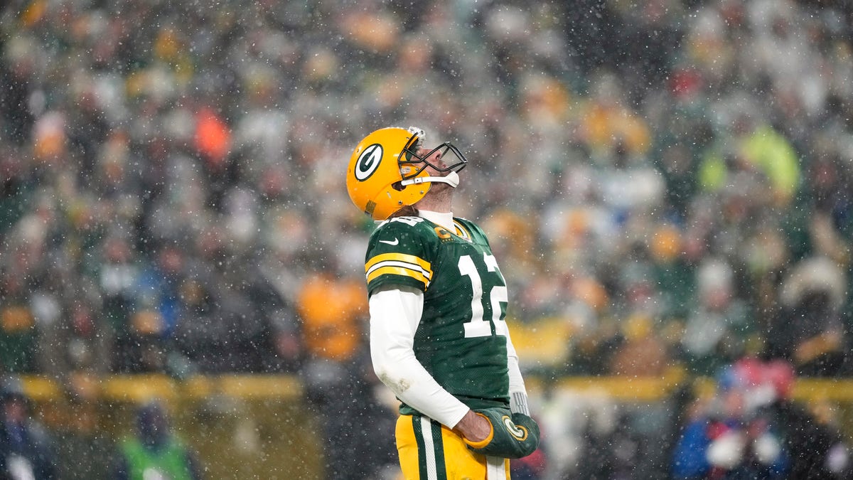 Aaron Rodgers stands at Lambeau Field