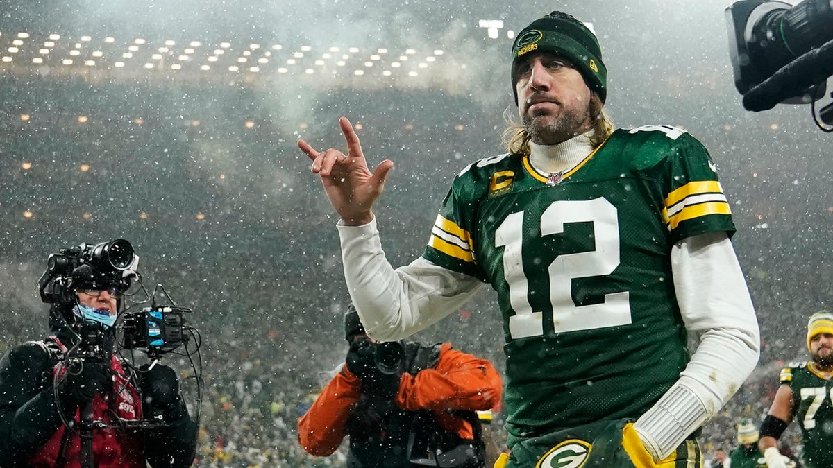 Quarterback Aaron Rodgers 12 of the Green Bay Packers gestures as he exits the field after losing the NFC Divisional Playoff game to the San Francisco 49ers at Lambeau Field on Jan. 22, 2022, in Green Bay, Wisconsin. 