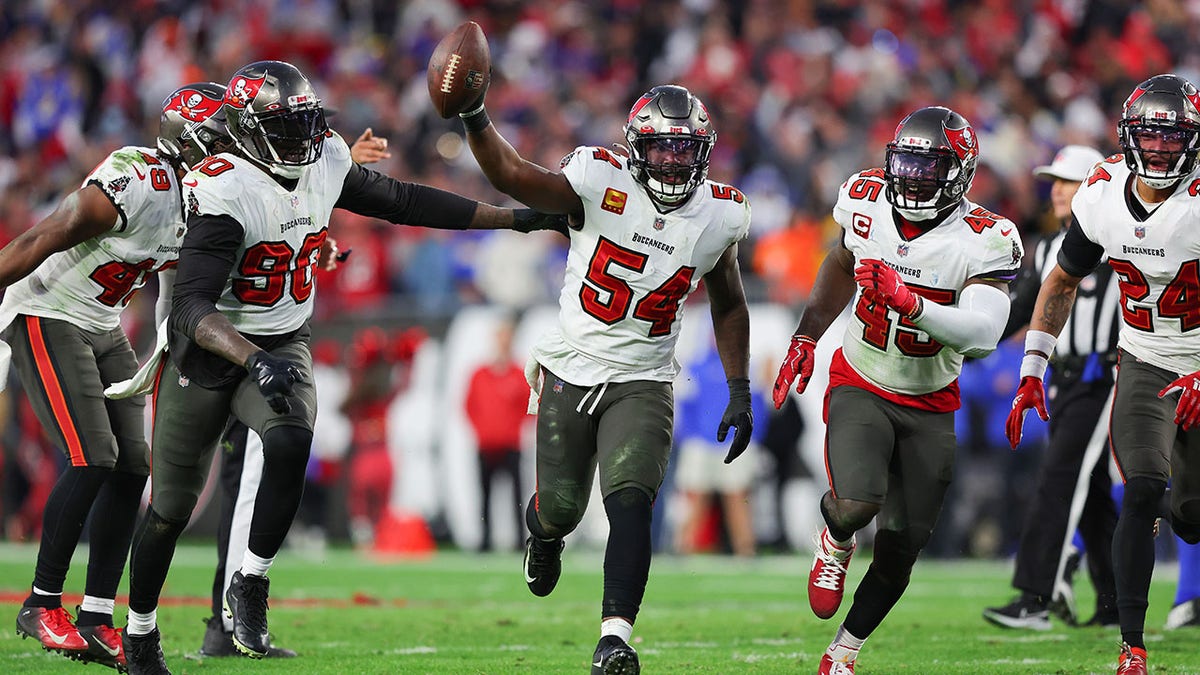 TAMPA, FLORIDA - JANUARY 23: Lavonte David #54 of the Tampa Bay Buccaneers reacts after getting a fumble recovery in the fourth quarter against the Los Angeles Rams in the NFC Divisional Playoff game at Raymond James Stadium on January 23, 2022 in Tampa, Florida.