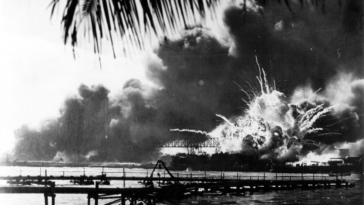 Japan attacks Pearl Harbor, forcing Americans into World War II