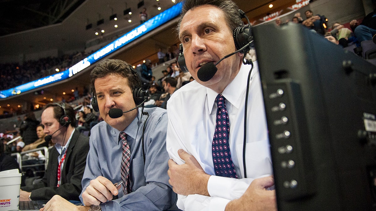 Wiz radio announcers, play by play man Dave Johnson center left, and color man Glenn Consor, right, keep their eye on the game that pits the Washington Wizards against the Golden State Warriors at the Verizon Center Feb. 24, 2015 in Washington, DC.