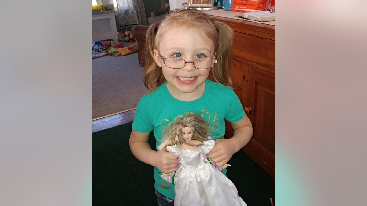 Harmony Montgomery is missing. The girl, in pigtails and glasses, holds a Barbie doll