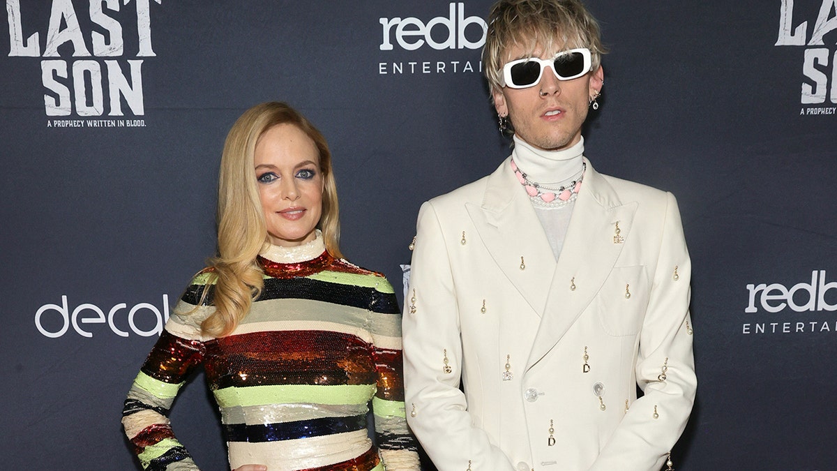 Heather Graham and Machine Gun Kelly, real name Colson Baker, starred alongside each other in ‘The Last Son.’ The film was released last month and Graham is already onto her next project, a psychological horror film titled, ‘Oracle,’ which is filmed in New Orleans.