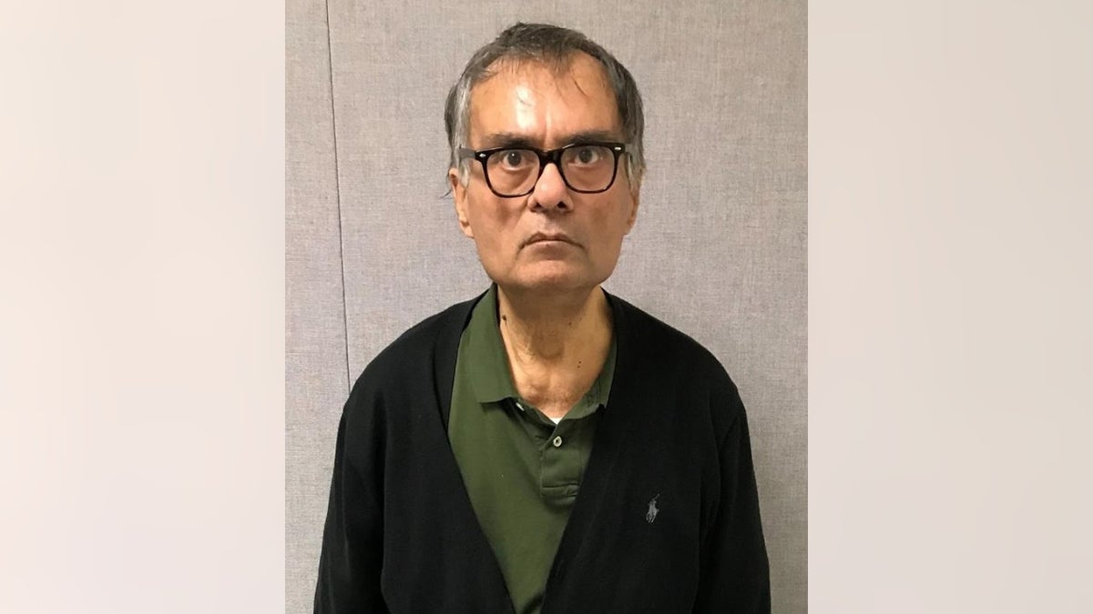 Himanshu Maganlal Tanna, 59, is charged intentionally hitting his with a car outside a Capital One Bank.