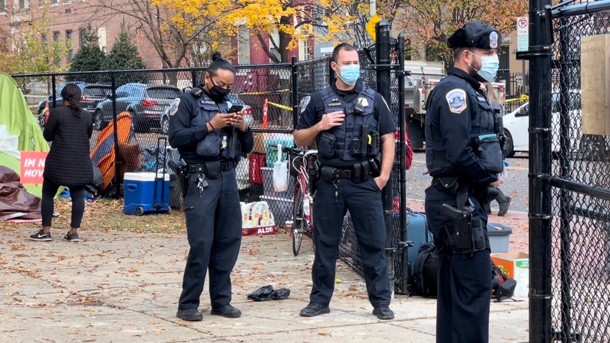 Metropolitan Police Department officers near a homeless encampment. (Fox News/Ethan Barton)