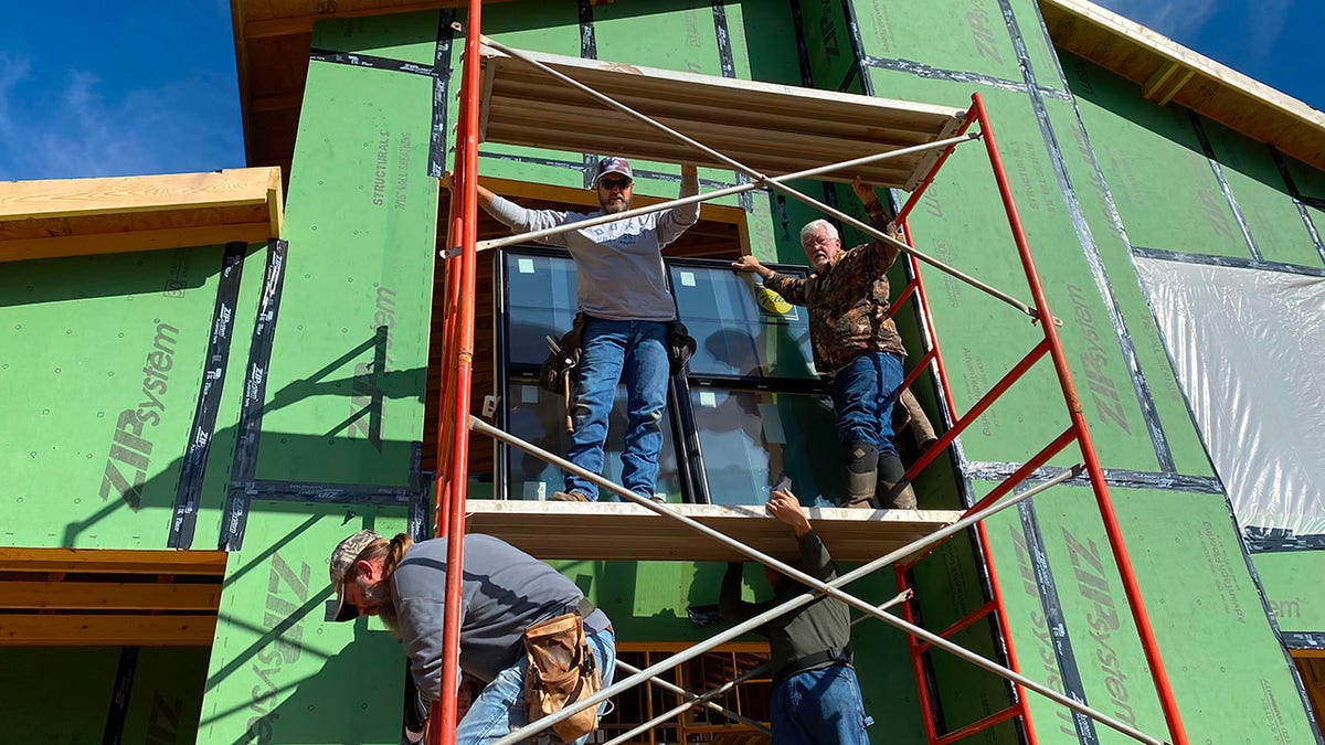 Crews build the first professional foster home in North Buncombe County. 