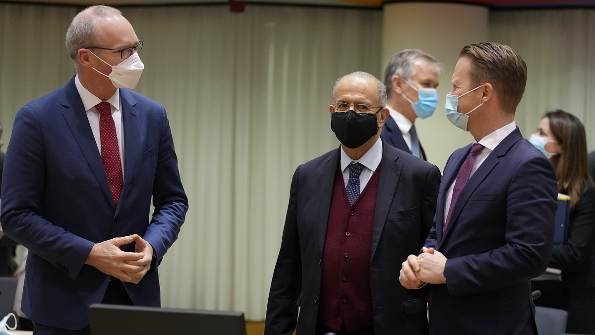 Ireland's Foreign Minister Simon Coveney, left, speaks with Cypriot Foreign Minister Ioannis Kasoulides, center, and Denmark's Foreign Minister Jeppe Kofod during a meeting of EU foreign ministers at the European Council building in Brussels on Monday. 
