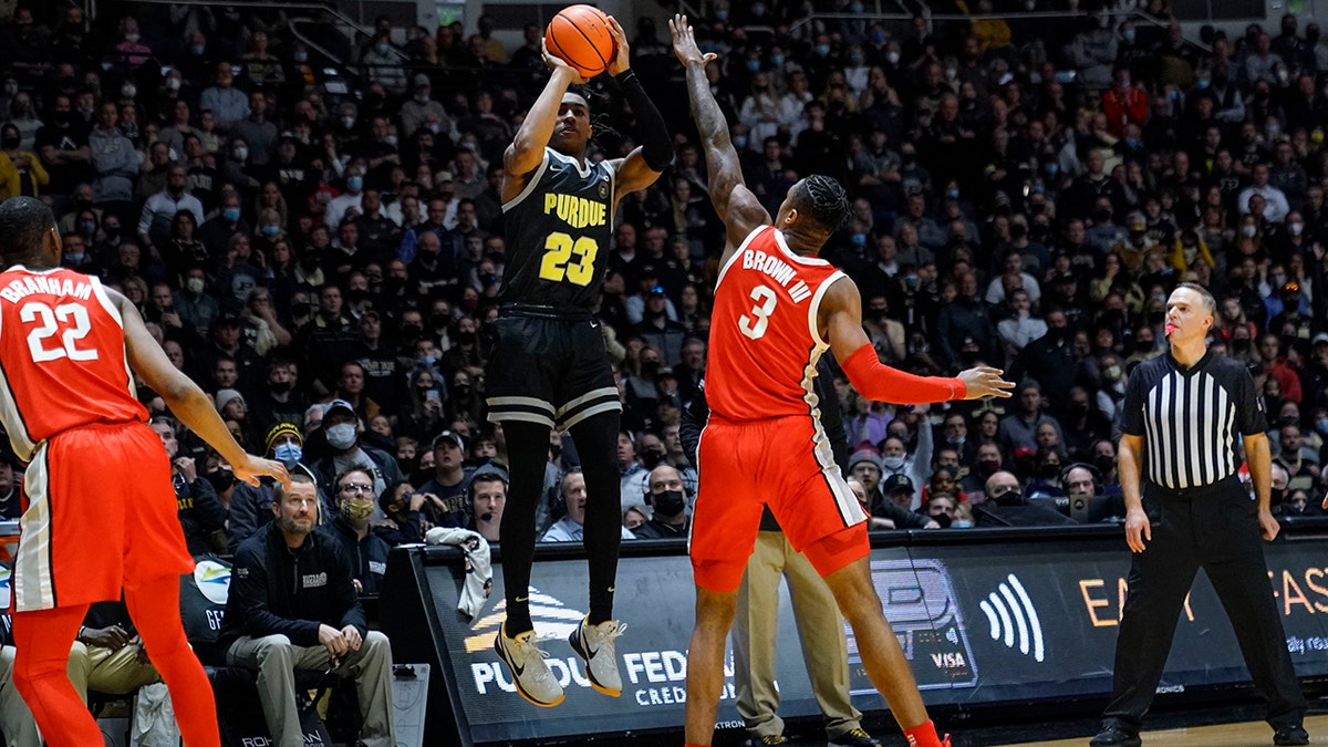 Purdue guard Jaden Ivey (23) shoots the game winning shot over Ohio State guard Eugene Brown III (3) in the second half of an NCAA college basketball game in West Lafayette, Ind., Sunday, Jan. 30, 2022. Purdue won 81-78.