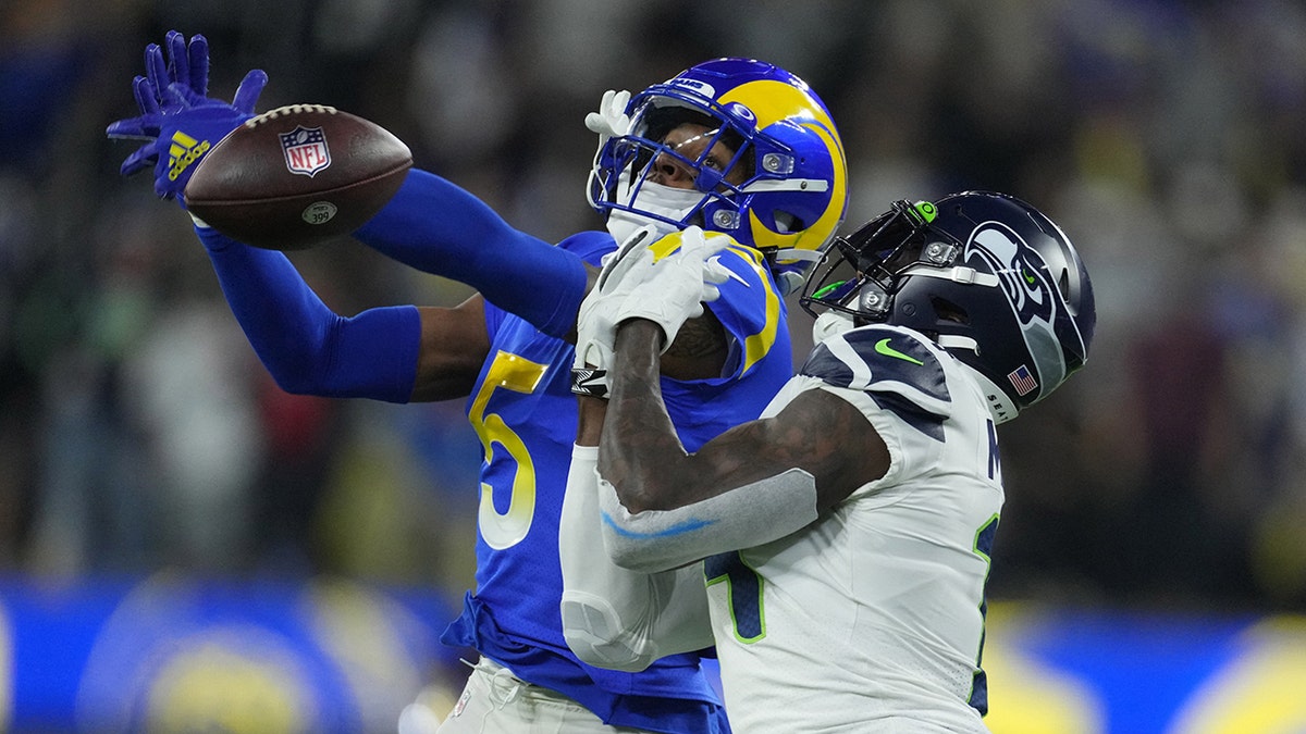 Los Angeles Rams cornerback Jalen Ramsey defends against Seattle Seahawks wide receiver DK Metcalf at SoFi Stadium in Inglewood, California, on Dec. 21, 2021.