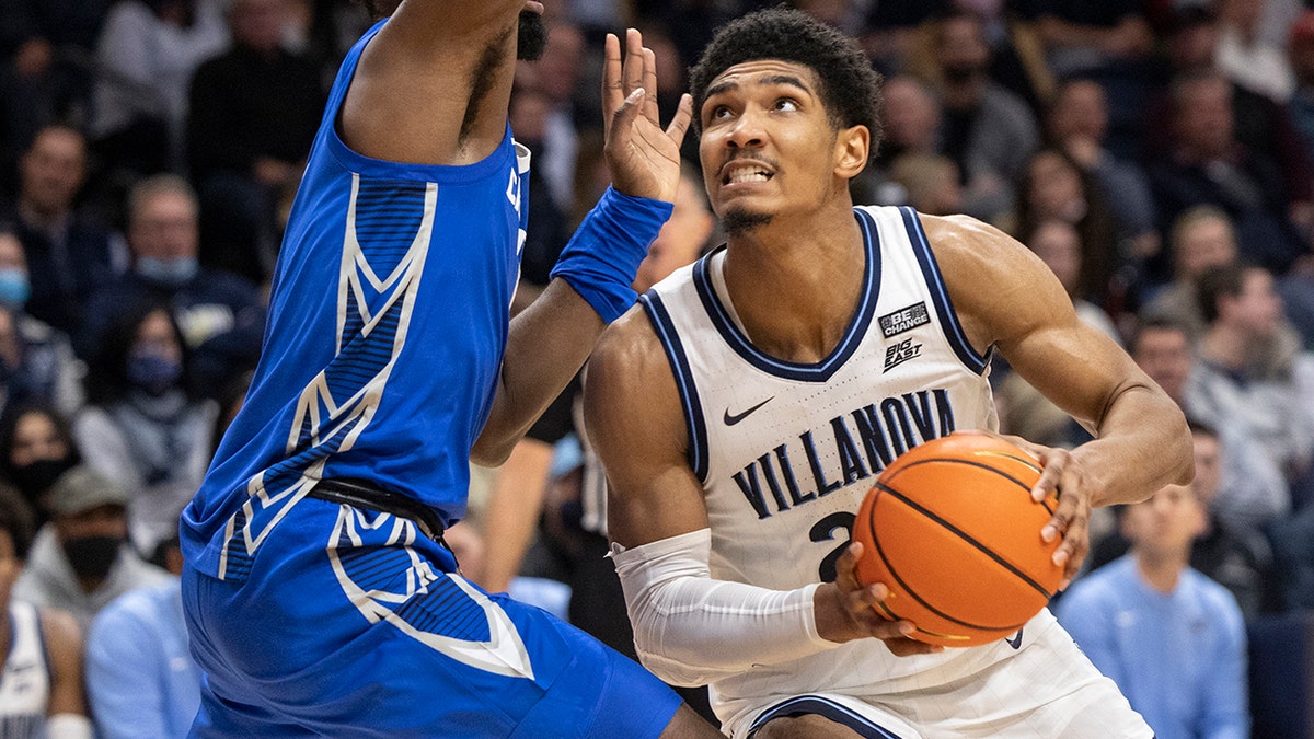 Villanova forward Jermaine Samuels (23) moves around Creighton forward KeyShawn Feazell (1) during the second half of an NCAA college basketball game, Wednesday, Jan. 5, 2022, in Villanova, Pa.