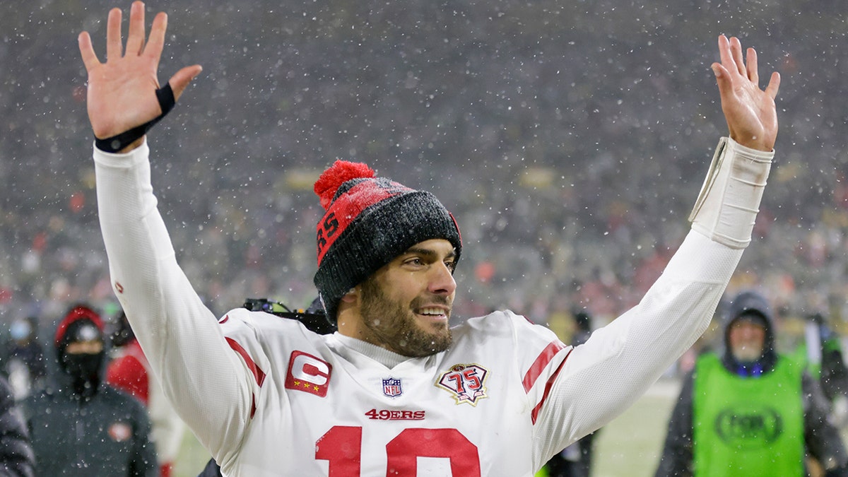 San Francisco 49ers' Jimmy Garoppolo celebrates after an NFC divisional playoff NFL football game Saturday, Jan. 22, 2022, in Green Bay, Wis. The 49ers won 13-10 to advance to the NFC Championship game.