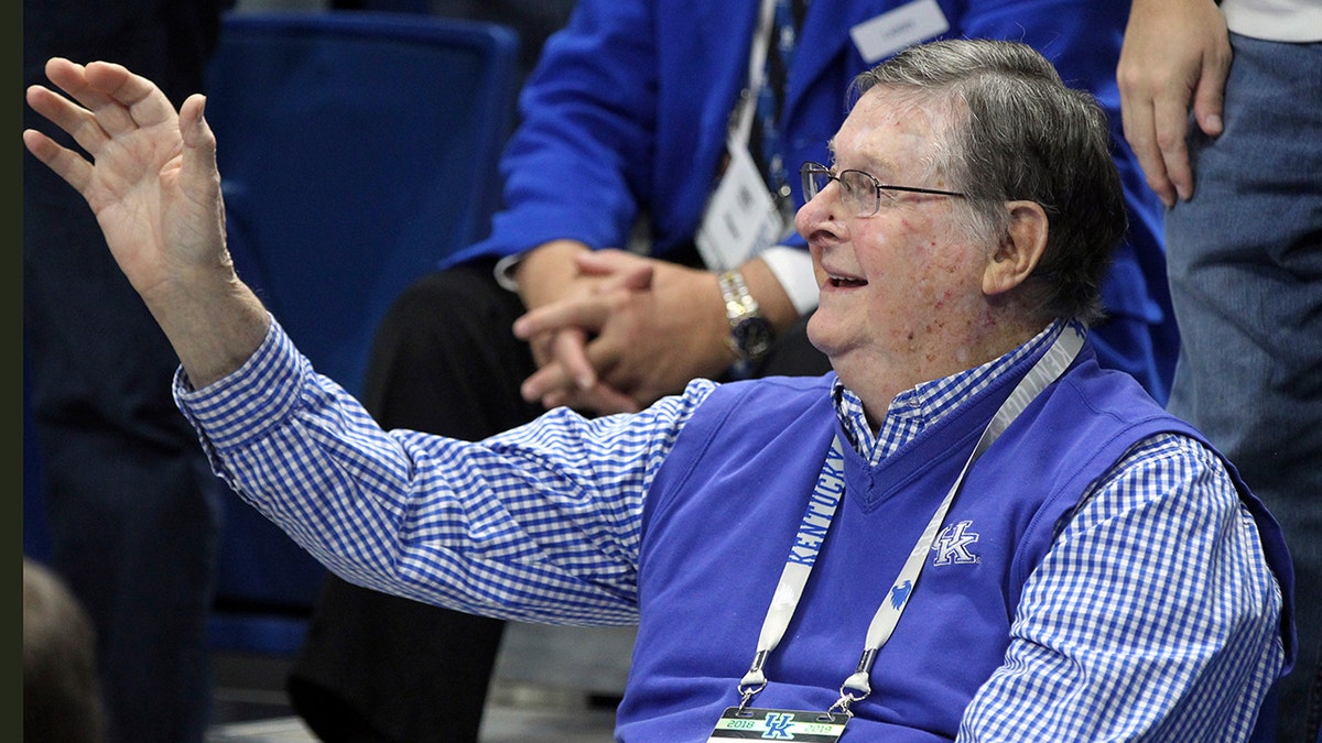 FILE - Former Kentucky coach Joe B. Hall waves to the crowd during the first half of the team's NCAA college basketball game against UAB in Lexington, Ky., Friday, Nov. 29, 2019. 