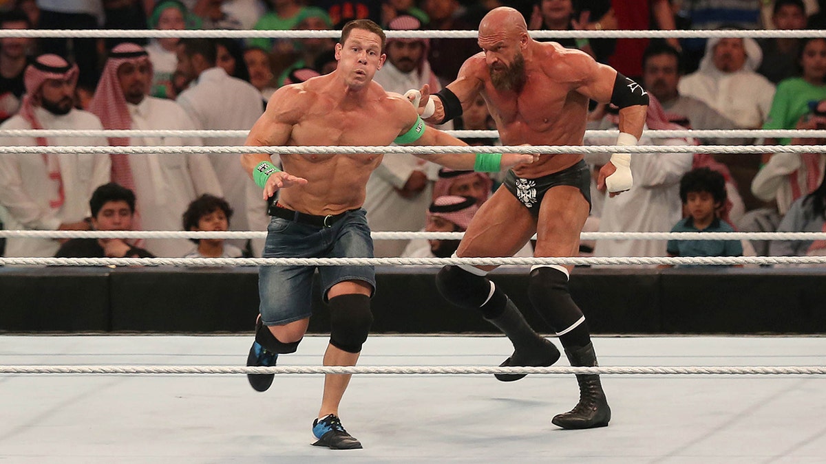 John Cena competes with Triple H during the World Wrestling Entertainment Greatest Royal Rumble event in the Saudi coastal city of Jeddah on April 27, 2018.