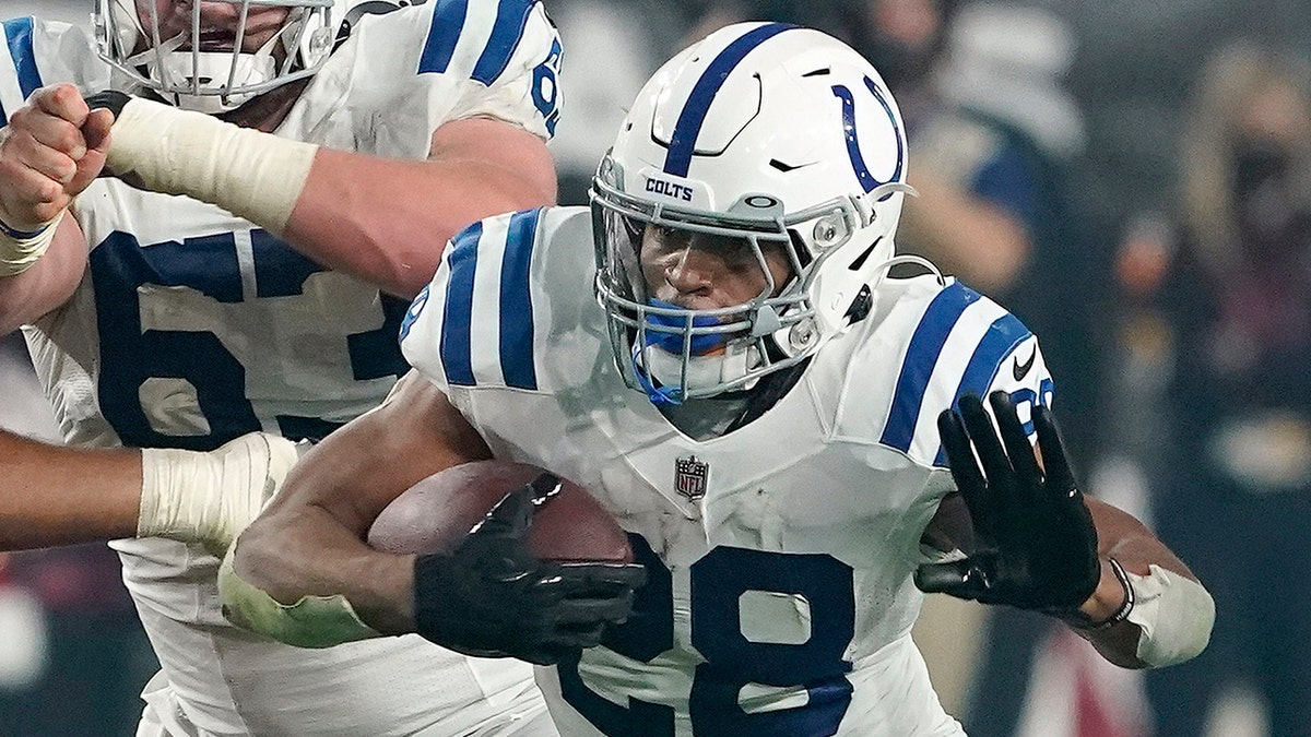 Indianapolis Colts running back Jonathan Taylor (28) plays against the Arizona Cardinals during an NFL football game on Dec. 25, 2021, in Glendale, Arizona.
