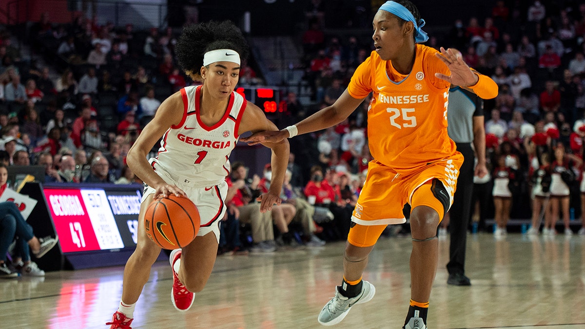 Georgia guard Chloe Chapman (1) drives past Tennessee guard Jordan Horston (25) during the second half of an NCAA college basketball game Sunday, Jan. 23, 2022, in Athens, Ga.