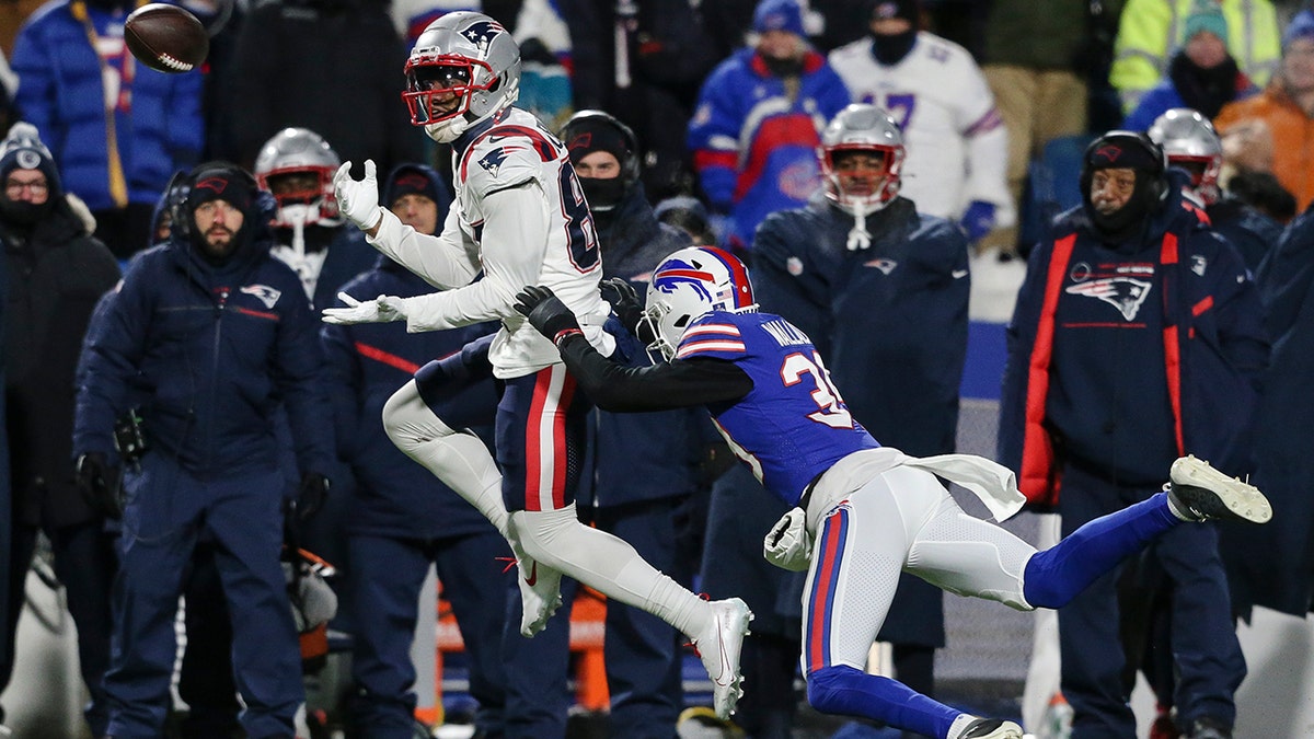 New England Patriots wide receiver Kendrick Bourne (84) makes a catch against Buffalo Bills cornerback Levi Wallace (39) during the first half of an NFL wild-card playoff football game, Saturday, Jan. 15, 2022, in Orchard Park, N.Y.