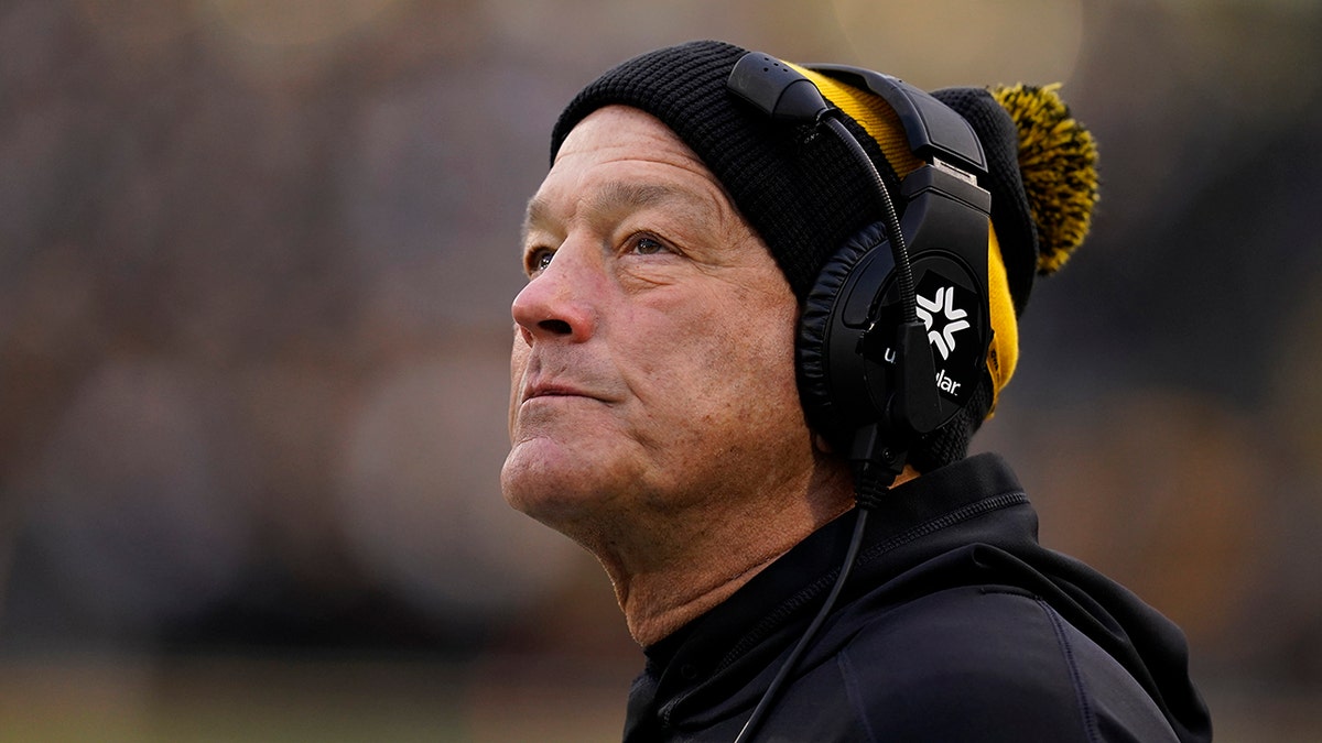 FILE - Iowa head coach Kirk Ferentz watches from the sideline during the first half of an NCAA college football game against Minnesota, Saturday, Nov. 13, 2021, in Iowa City, Iowa.