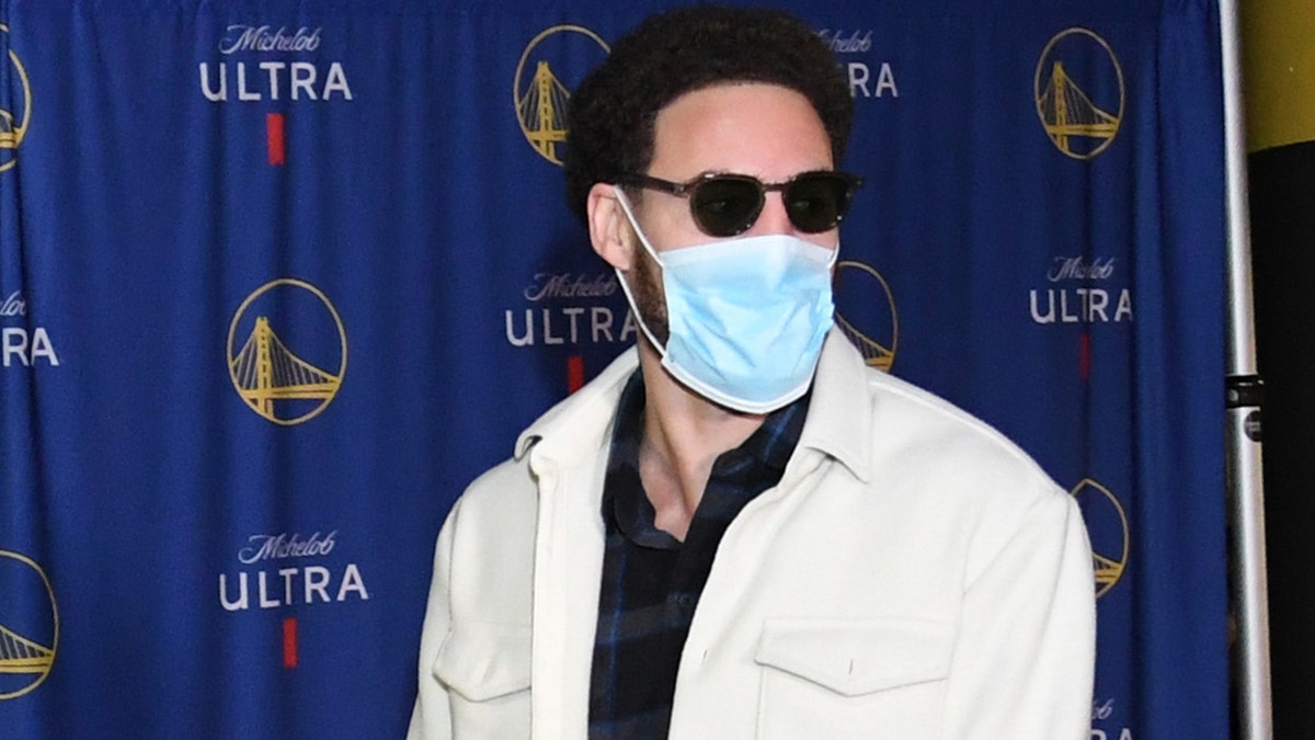 Klay Thompson #11 of the Golden State Warriors arrives to the arena before the game against the Cleveland Cavaliers on January 9, 2022 at Chase Center in San Francisco, California.