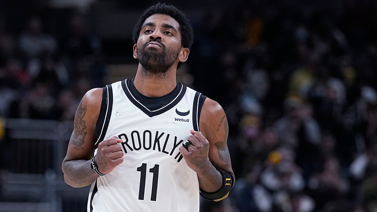 Brooklyn Nets' Kyrie Irving reacts after hitting a shot during the second half of the team's NBA basketball game against the Indiana Pacers, Wednesday, Jan. 5, 2022, in Indianapolis.
