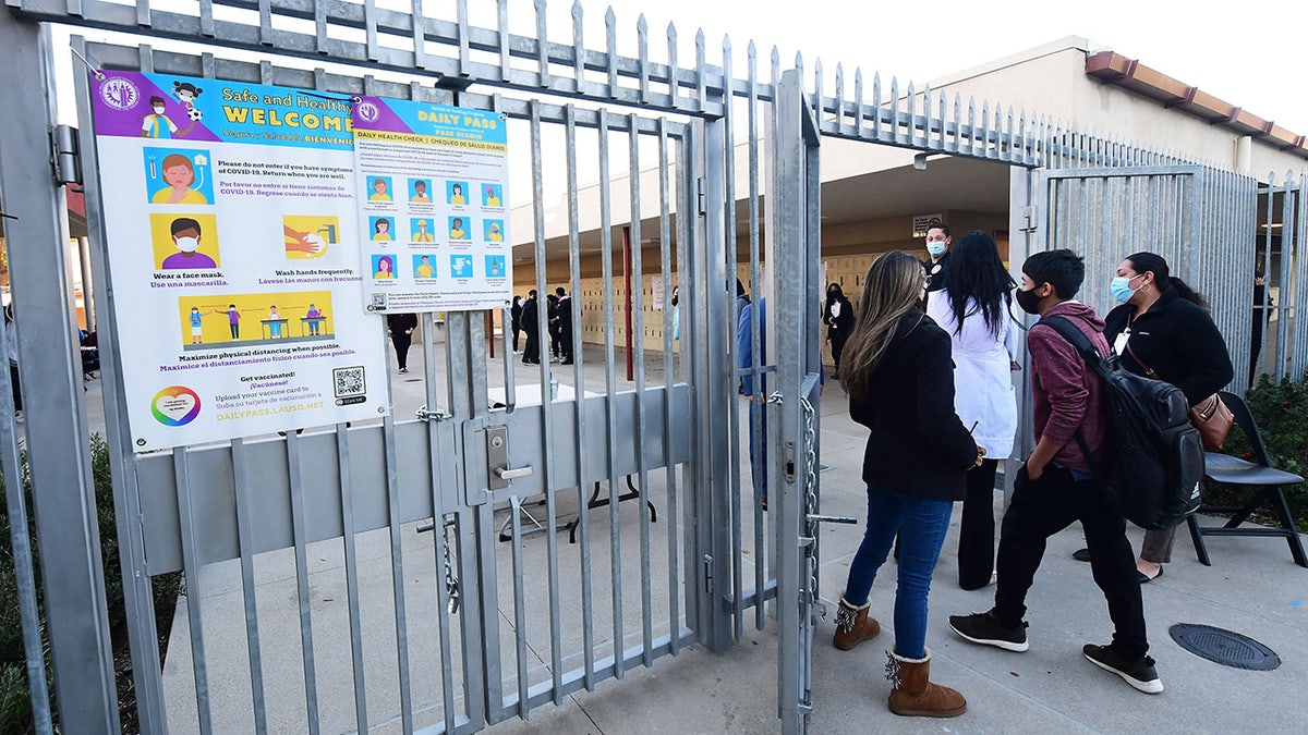 Masked students return to school 