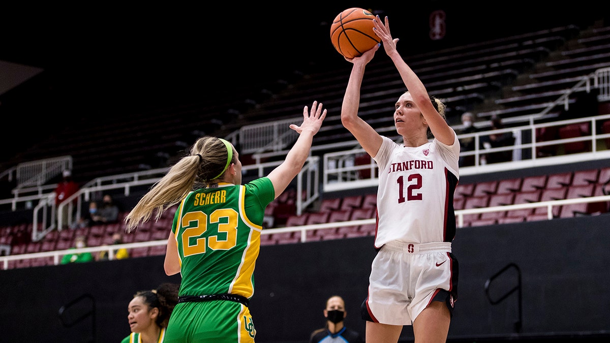 Stanford guard Lexie Hull (12) shoots over Oregon guard Maddie Scherr (23) during the second half of an NCAA college basketball game Friday, Jan. 7, 2022, in Stanford, Calif. 
