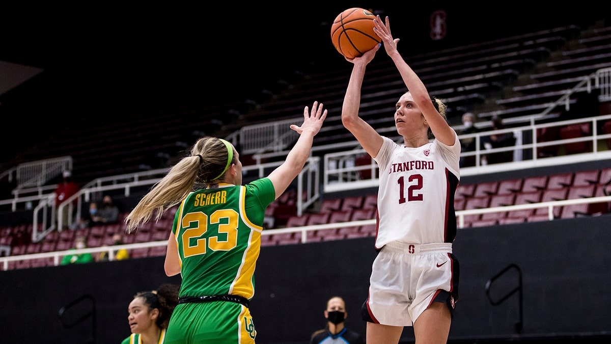 Stanford guard Lexie Hull (12) shoots over Oregon guard Maddie Scherr (23) during the second half of an NCAA college basketball game Friday, Jan. 7, 2022, in Stanford, Calif.