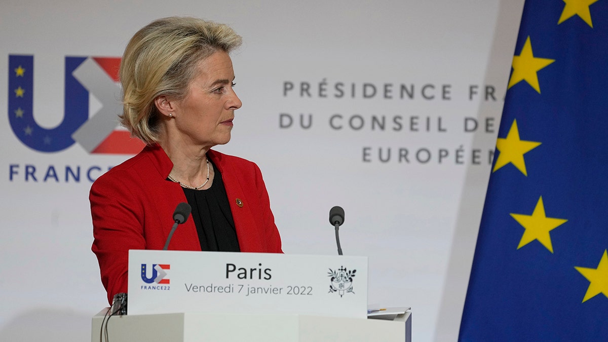 European Commission President Ursula von der Leyen listens to questions from journalists as she participates in a media conference with French President Emmanuel Macron after a meeting at the Elysee Palace in Paris, France, Friday, Jan. 7, 2022. 