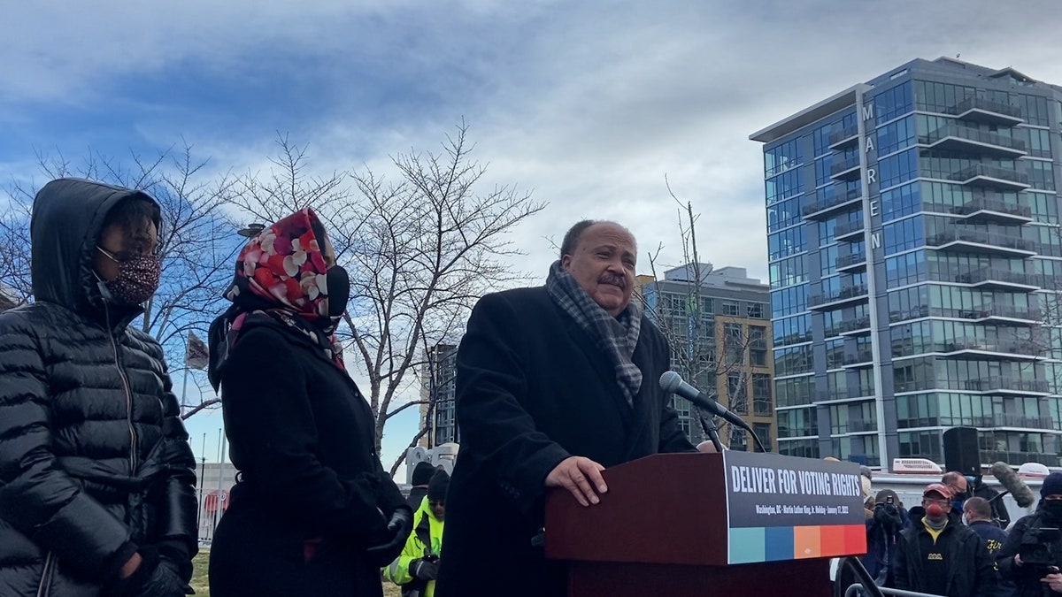 Martin Luther King III speaks to the crowd ahead of the march