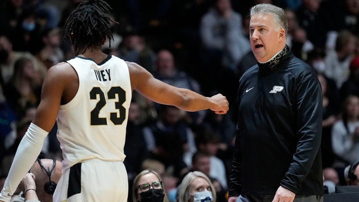 Purdue head coach Matt Painter, right, talks with his player Jaden Ivey while their team played Nebraska in the second half of an NCAA college basketball game in West Lafayette, Ind., Friday, Jan. 14, 2022. Purdue won 92-65.