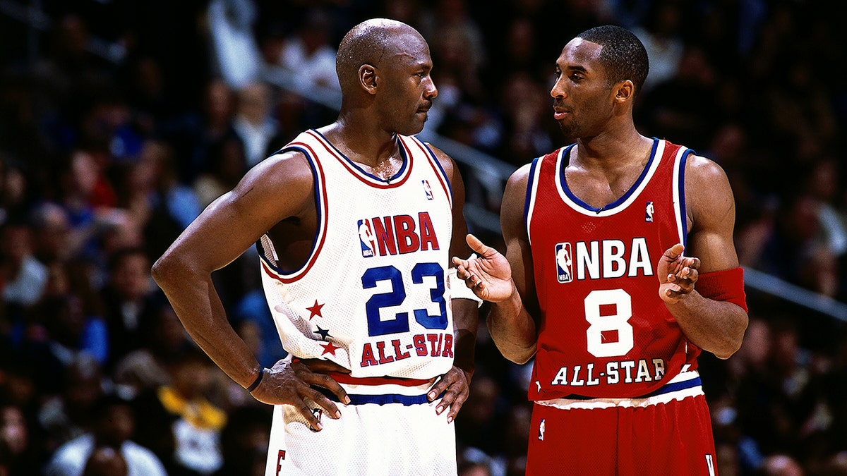Kobe Bryant talks with Michael Jordan during the 2003 NBA All-Star Game at the Phillips Arena on Feb. 9, 2003 in Atlanta, Georgia.