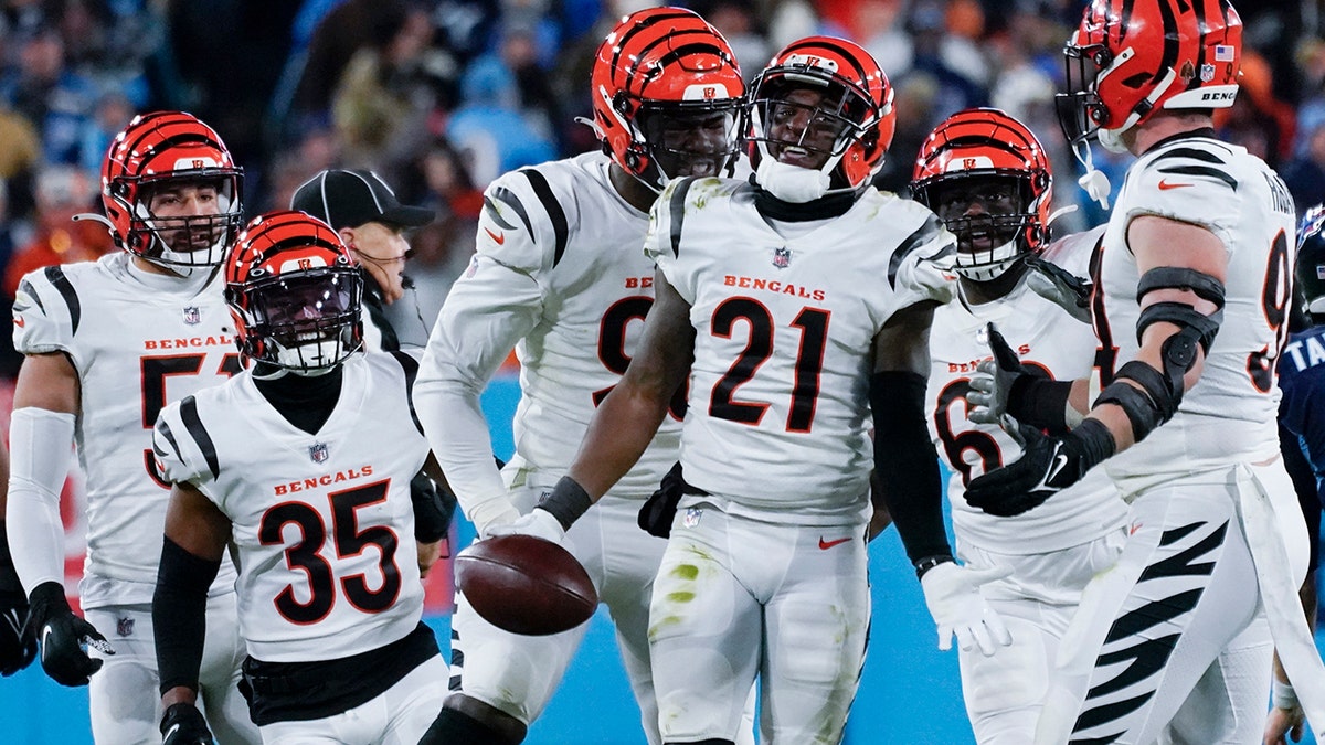 Cincinnati Bengals cornerback Mike Hilton (21) celebrates and interception he made against Tennessee Titans quarterback Ryan Tannehill (17) during the second half of an NFL divisional round playoff football game, Saturday, Jan. 22, 2022, in Nashville, Tenn.