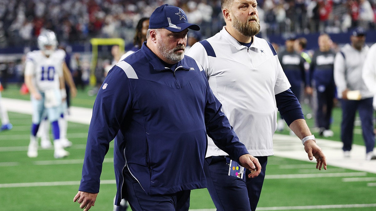 Head coach Mike McCarthy of the Dallas Cowboys walks off the field after losing to the San Francisco 49ers 23-17 in the NFC Wild Card Playoff game at AT&amp;T Stadium on January 16, 2022 in Arlington, Texas.