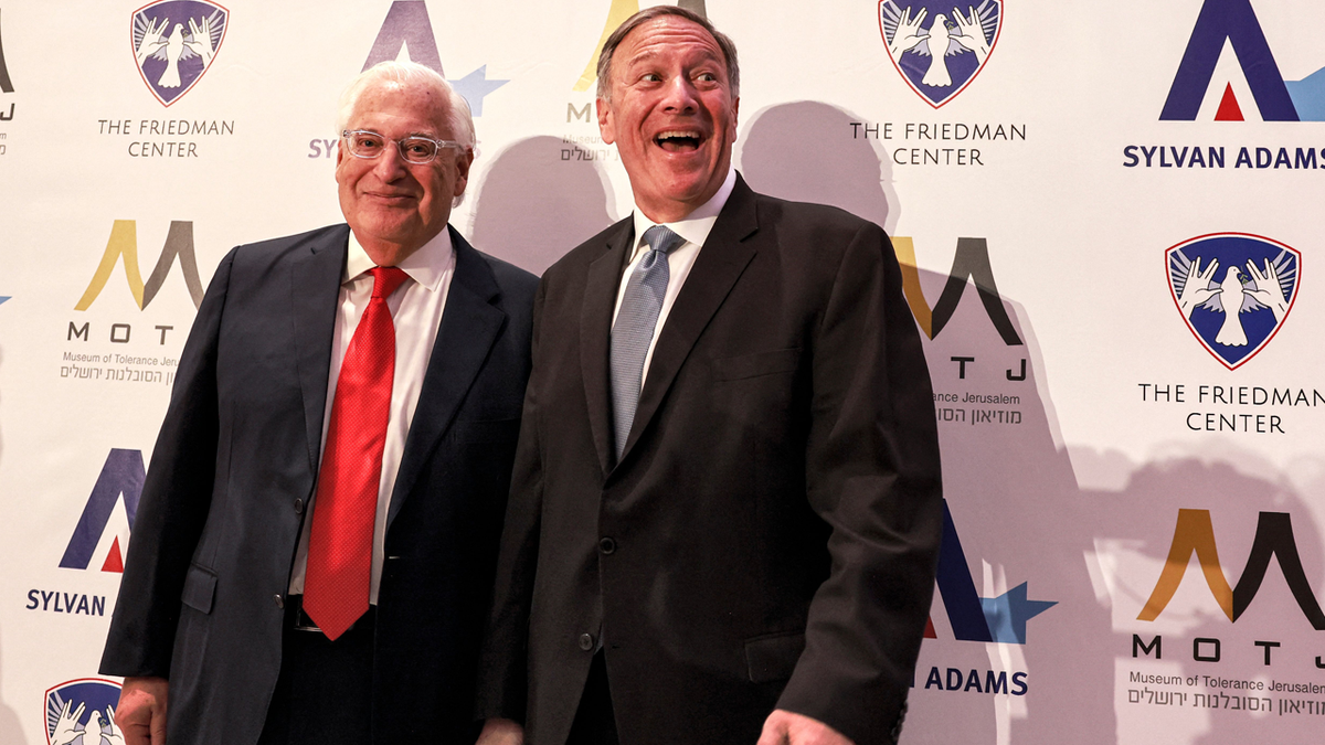 Former US ambassador to Israel David Friedman and former US Secretary of State Mike Pompeo. (Photo by MENAHEM KAHANA/AFP via Getty Images)
