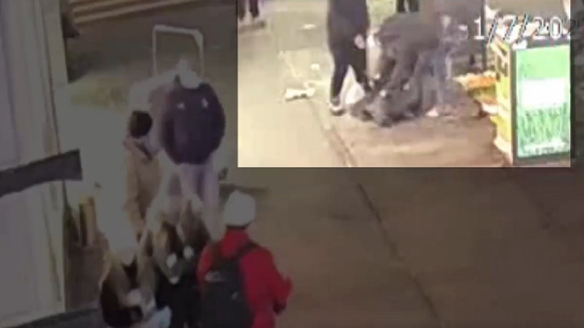 The victim is seen being held to the ground during the attack. (NYPD