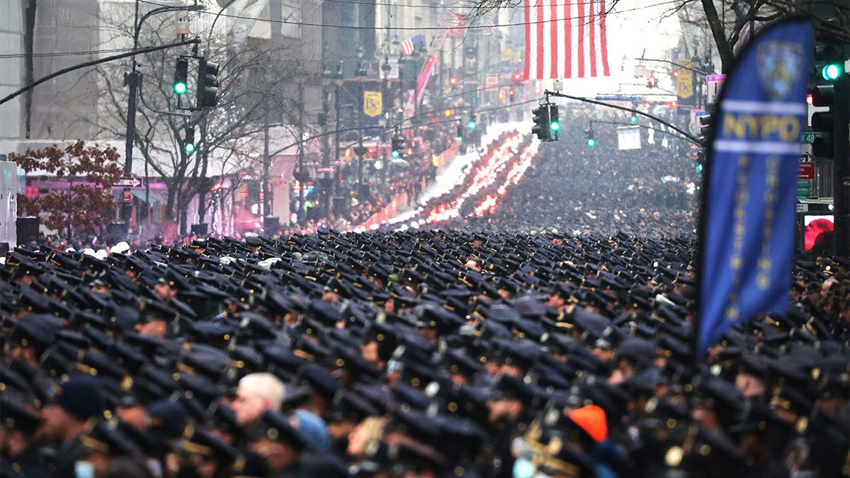 Thousands of police officers from around the country gather at St. Patrick's Cathedral to attend the funeral for fallen NYPD Officer Jason Rivera 