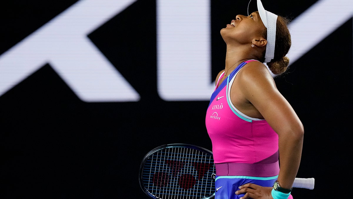 Naomi Osaka of Japan reacts during her third-round match against Amanda Anisimova of the U.S. at the Australian Open tennis championships in Melbourne, Australia, Friday, Jan. 21, 2022.