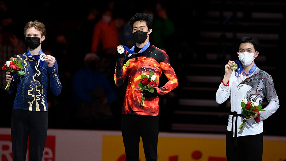 First place, Nathan Chen stands with second place, Ilia Malinin left, third place, Vincent Zhou during the medal ceremony for the men's free skate program during the U.S. Figure Skating Championships Sunday, Jan. 9, 2022, in Nashville, Tenn.