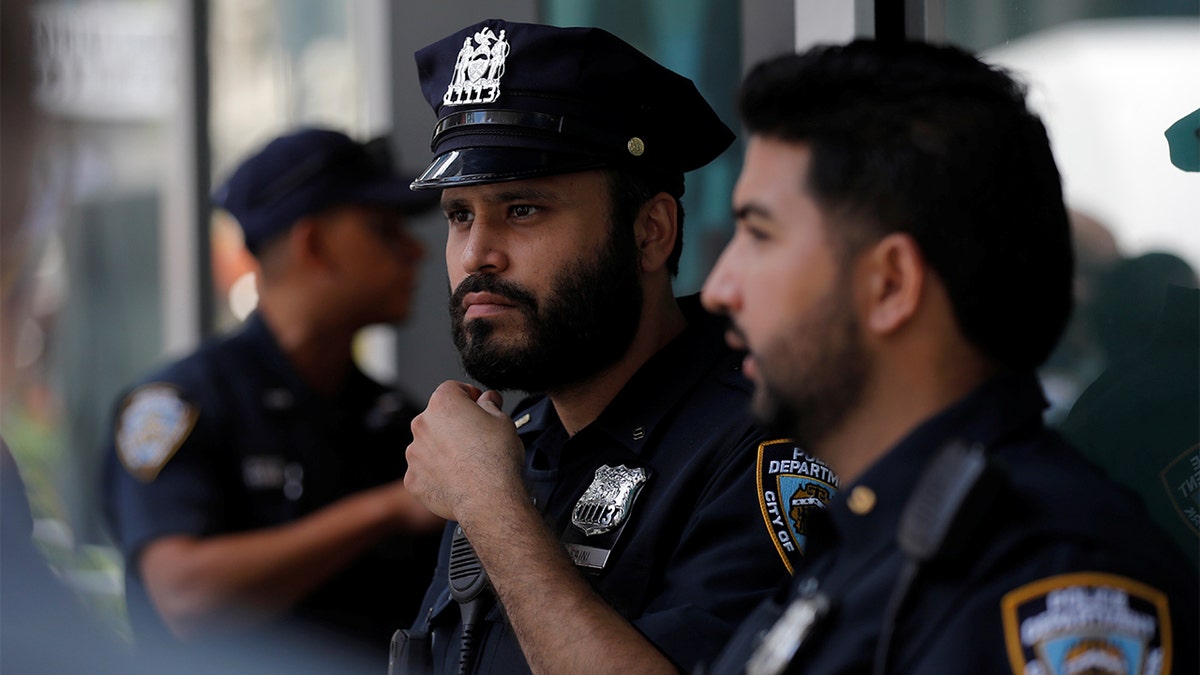 Police officer talking into a radio