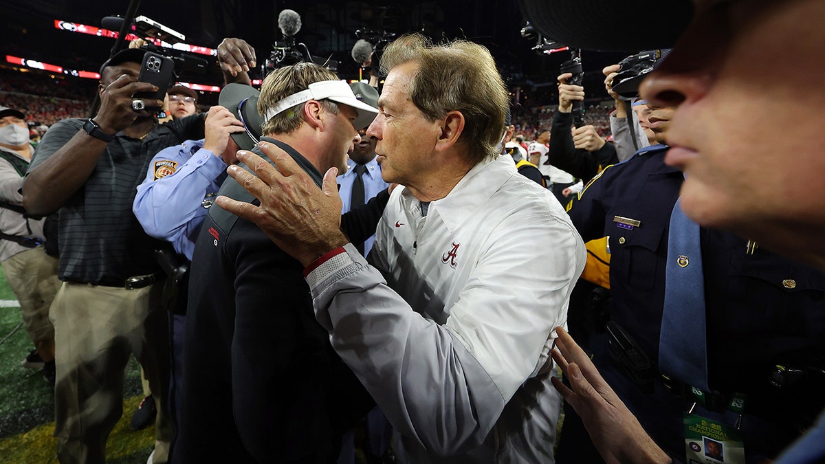 Head coach Nick Saban of the Alabama Crimson Tide and head coach Kirby Smart of the Georgia Bulldogs shake hands after the Georgia Bulldogs defeated the Alabama Crimson Tide 33-18 in the 2022 CFP National Championship Game at Lucas Oil Stadium on Jan. 10, 2022, in Indianapolis, Indiana.