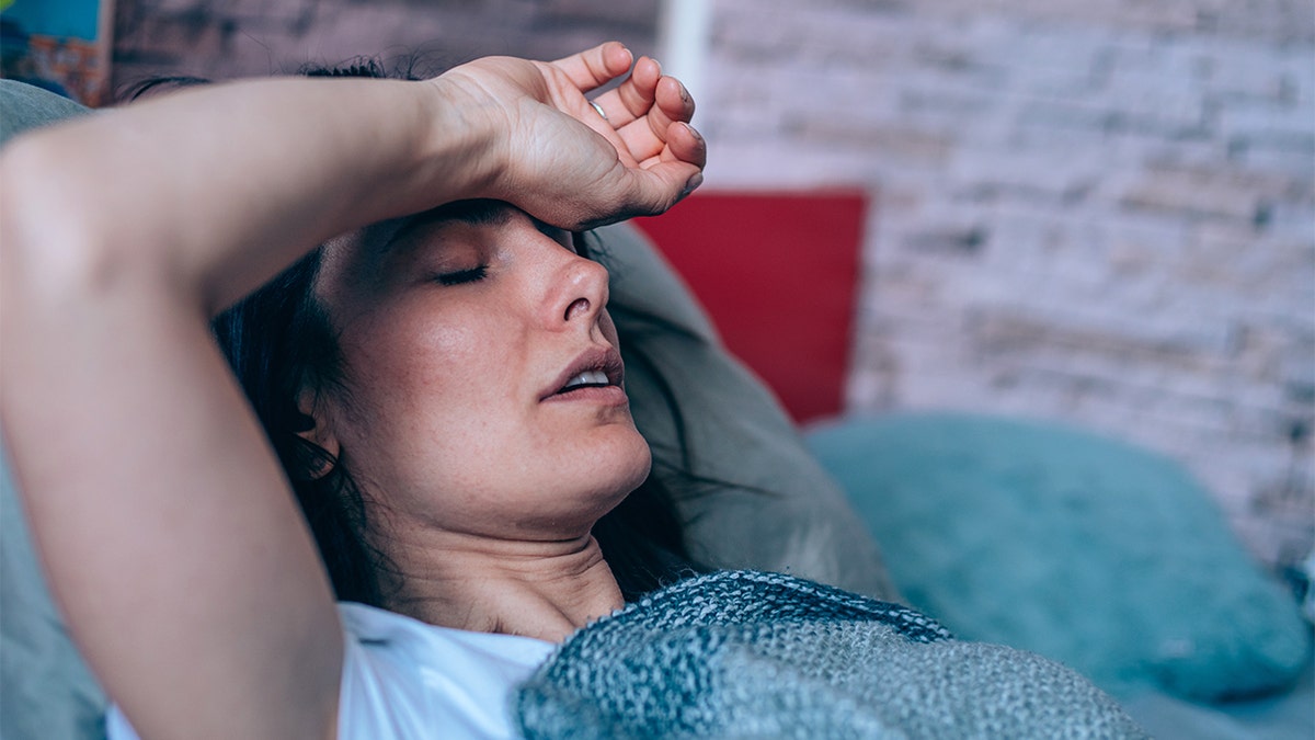 woman sick in bed