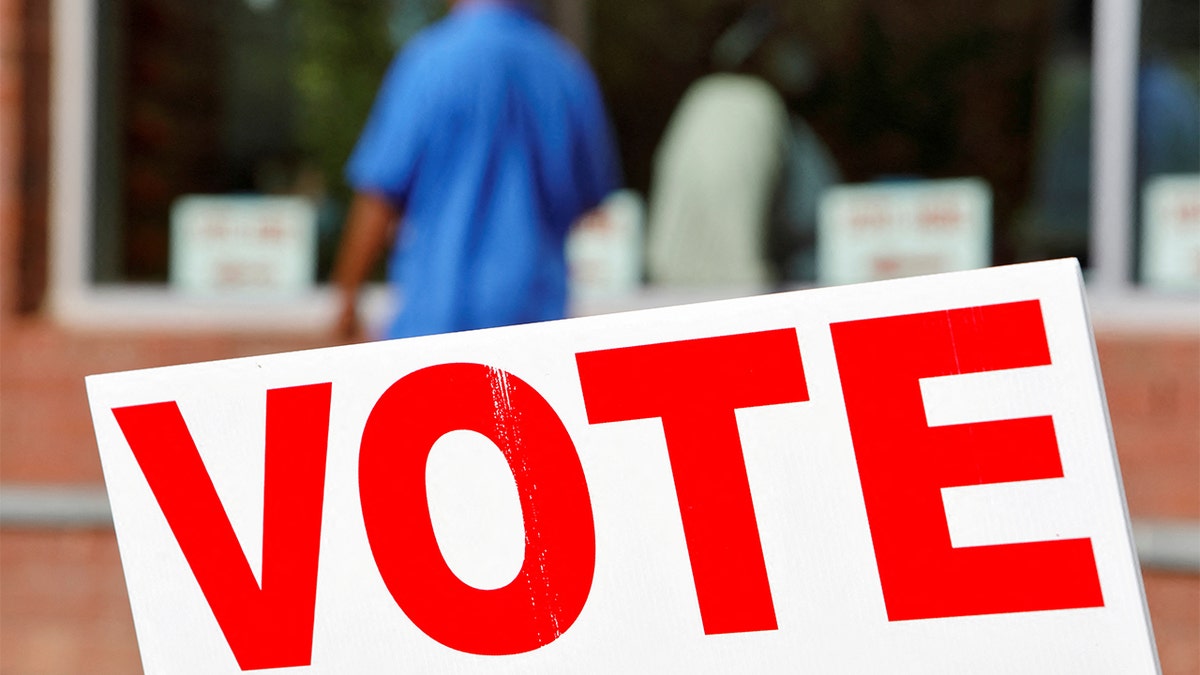 Signs direct voters into a polling station during the 2020 presidential election in Durham, North Carolina, Nov. 3, 2020.