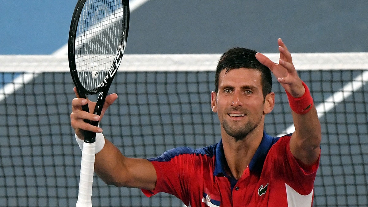 Serbia's Novak Djokovic celebrates beating Japan's Kei Nishikori during their Tokyo 2020 Olympic Games men's singles quarterfinal tennis match at the Ariake Tennis Park in Tokyo on July 29, 2021. (Photo by Tiziana FABI / AFP) (Photo by TIZIANA FABI/AFP via Getty Images)