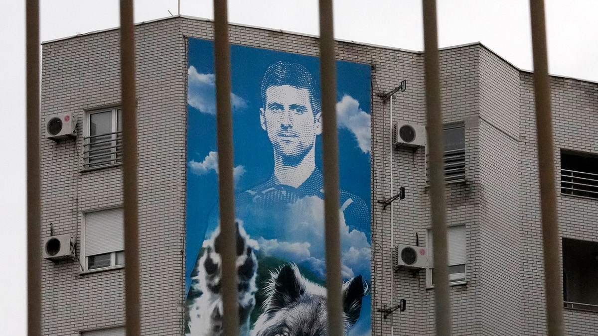A billboard depicting Serbian tennis player Novak Djokovic hangs on a building in Belgrade, Serbia, Thursday, Jan. 6, 2022. 